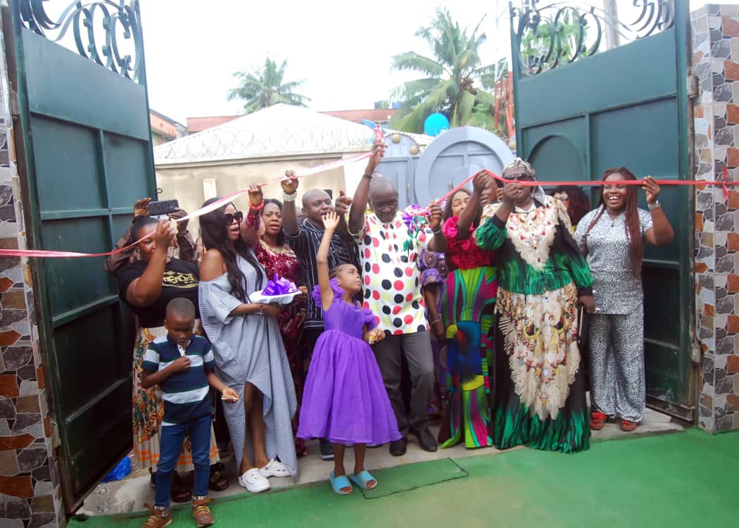 A caregiver and children at Royal Palm Orphanage